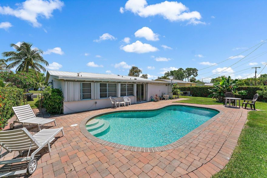 Located in the heart of Lake Park this mid-century 3 bedroom, 2 bathroom single family home features original terrazzo floors throughout, a beautiful kitchen with gas stove, wine refrigerator and large center island perfect to entertain and cook. The adjoining family room with its beautiful wood ceiling opens to a private backyard oasis with pool and plenty of space to relax and play. There are no direct neighbors to the south due to a utility easement. This non HOA community is just a short walk to the restaurants and shops on Park Avenue and only minutes away to Kelsey Park and Singer Island's gorgeous beaches.