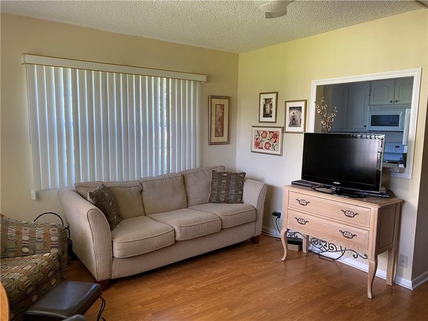 CORNER UNIT, FIRST FLOOR, 1 BEDROOM 1.5 BATH. THIS BRIGHT & LIGHT NICELY FURNISHED UNIT IS MOVE IN READY. LAMINATED FLOORING, GRANITE COUNTER TOPS, ENCLOSED PATIO WITH DOOR TO PARKING SPOT RIGHT OUT FRONT. BOTH BATHS HAVE NEW VANITIES, MASTER BATH HAS WALK IN SHOWER. LOCATED IN QUIET AREA OF THE VILLAGE IT IS STEPS TO UPMINSTER POOL AND CENTURY PLAZA. CLUBHOUSE HAS MOVIE THEATER, STATE OF THE ART FITNESS CENTER, HOBBY ROOMS, CLUBS, AND CAFE ON PROPERTY. SHUTTLE BUS TO MALLS AND GROCERY STORES. THIS IS A NON-RENTAL BUILDING.  APPROXIMATELY 4 MILES TO BEACH. ASSOCIATION CLAIM 55.MONTHLY TOTAL FEES $386.99, SEACREST $156.49, CENCLUB $102.50 CVEMM $128.00