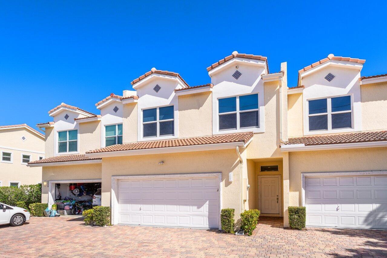 East Boca Raton updated townhome you can walk to the beach from. This large 4 bedroom and tastefully updated two level townhome. is ready for it's next owner. With low HOA fees in a small community of 5 homes with community pool. Roof 2022. Home features NEW open gourmet kitchen 3 full redone bathrooms. Hurricane glass windows throughout. Fabulous paved and fenced in outdoor space off the great room with mature landscaping for shade and privacy. Downstairs there is one bedroom (currently set up as an office), and the main bedroom and two others are up. Laundry room and separate HVAC (2018) room are also upstairs. Large main suite has a covered balcony and two walk in/built in closets. Property has a community pool (only 5 units) 10ft ceilings in the main bedroom facing East