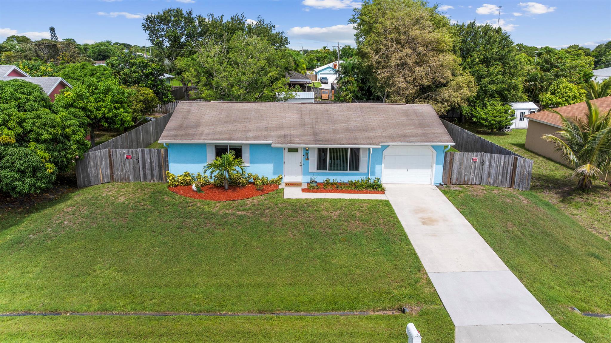 NEW ROOF PAID FOR BY SELLER & INSTALLED BEFORE CLOSING! Step into this beautifully remodeled 2-bedroom gem featuring NEW IMPACT windows and doors, a 2021 A/C, 2025 roof, 2021 instant water heater, 2021 privacy fence, and 2023 stainless steel kitchen appliances! The kitchen stuns with quartz countertops, a modern sink, and a gorgeous tile backsplash. The renovated bathroom includes a sleek new vanity and stylish shower tile.You'll love the spacious walk-in closets, ALL new window treatments, upgraded lighting throughout, a 6x8 storage shed, and even a generator hook-up for added peace of mind. Located just minutes from shopping, dining, and the hospital -- and only 15 minutes to the beach! This home checks ALL the boxes. Don't miss out!
