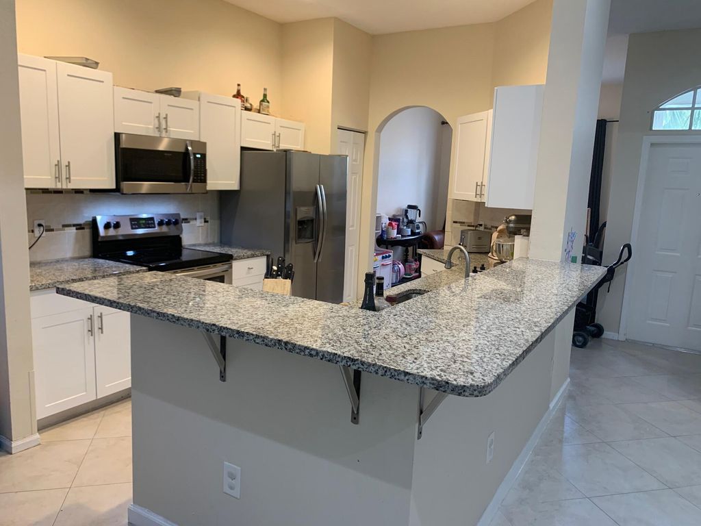 Photo of 13572 Weyburne Drive, Delray Beach, FL 33446 (MLS # R10951135)