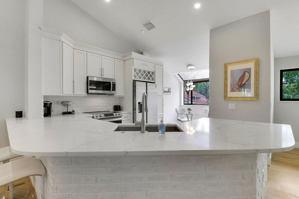 Photo of 104 Sea Oats Drive #G, Juno Beach, FL 33408 (MLS # B26017355)