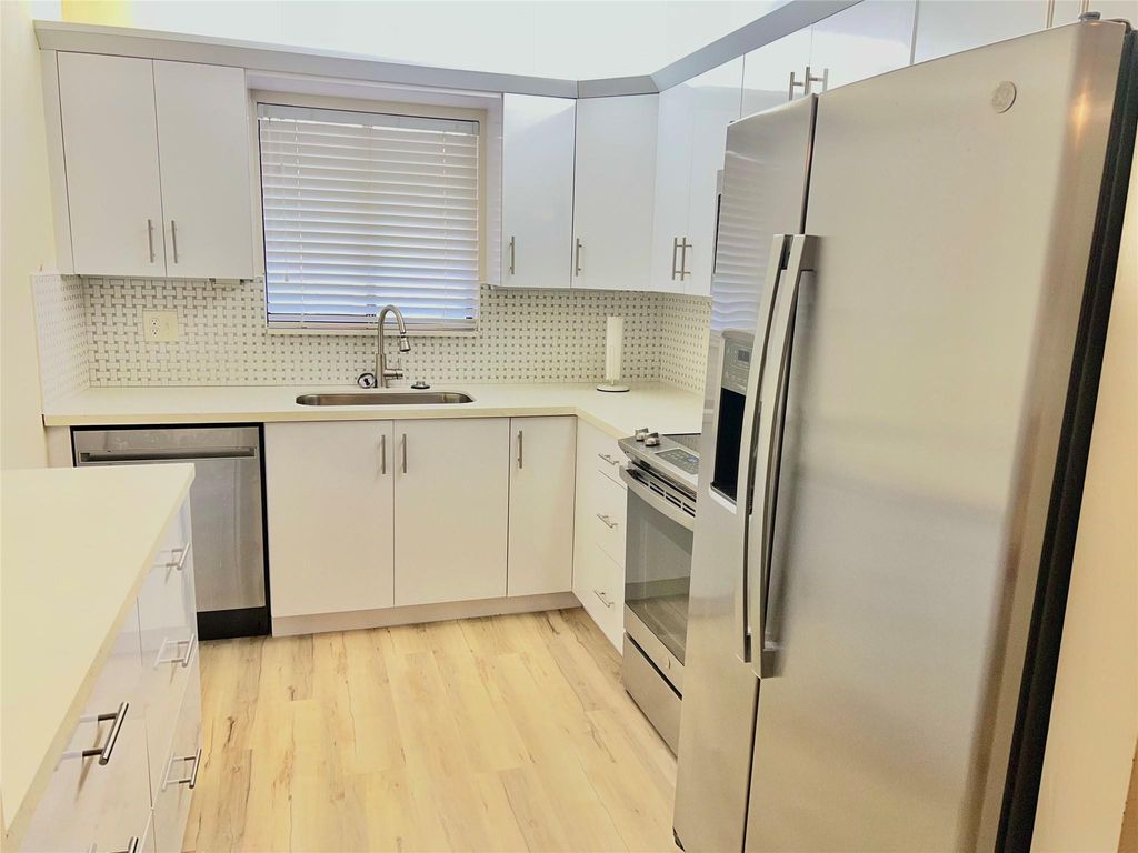 Photo of 7426 Ashmont Circle #211, Tamarac, FL 33321 (MLS # F10552396)