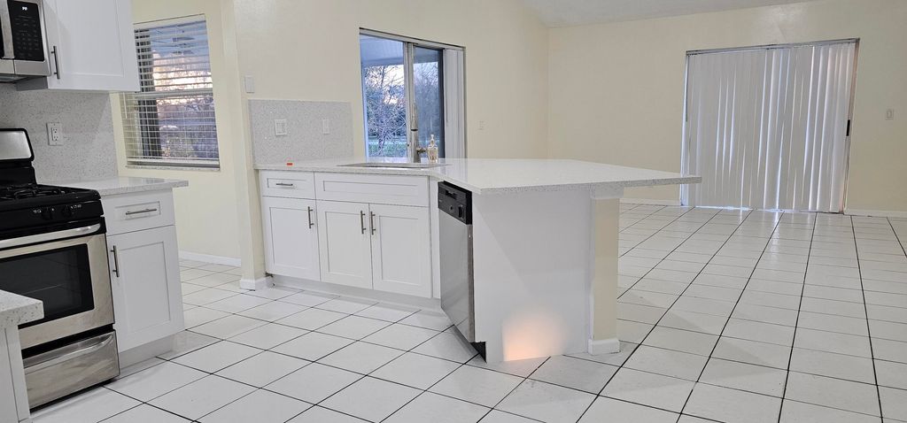Photo of 1488 Fairway Circle, Greenacres, FL 33413 (MLS # B26013063)