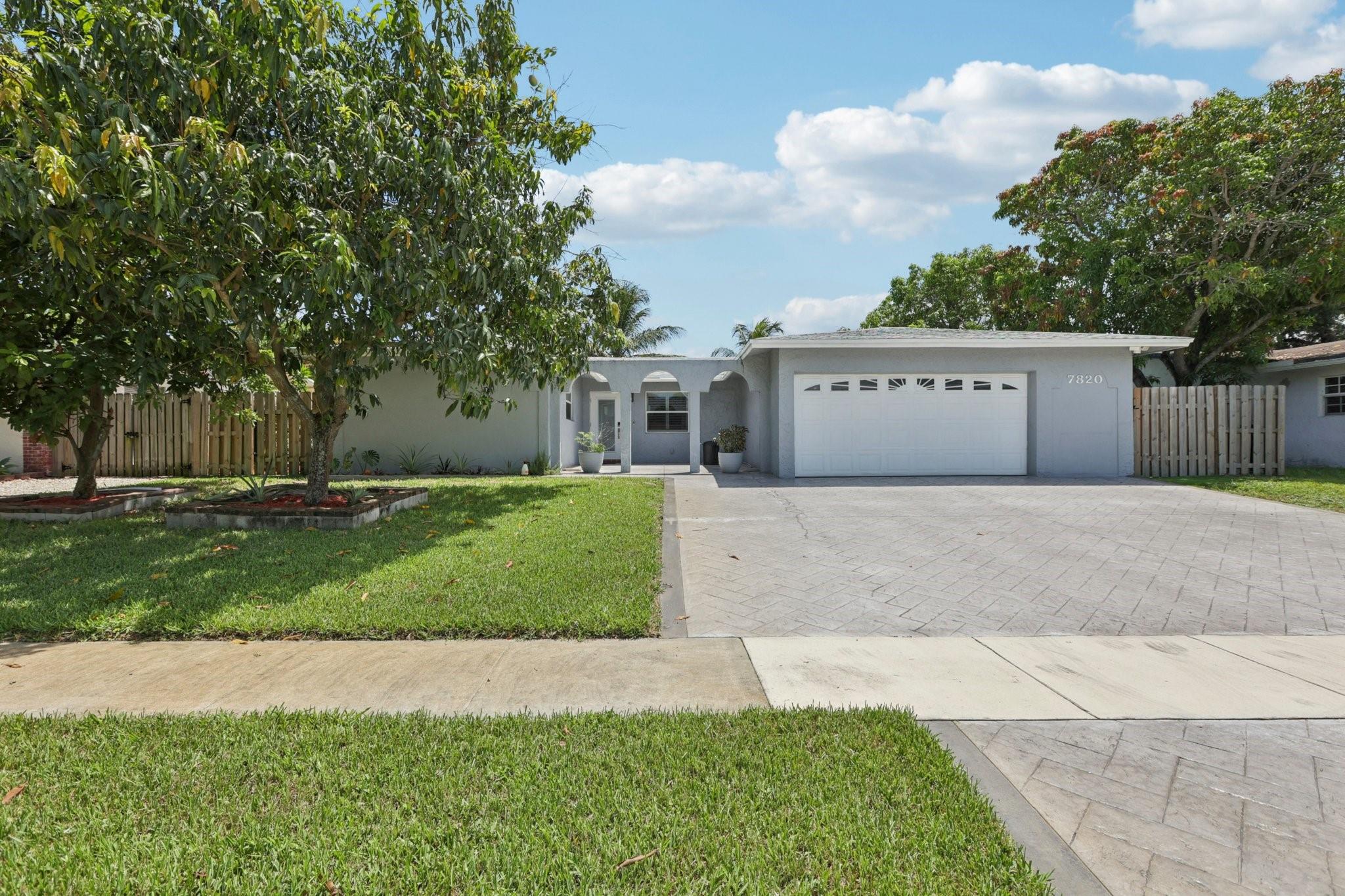 Welcome to this well-maintained single-family home located at 7820 NW 45th St, Lauderhill, FL 33351. This residence features a spacious kitchen perfect for cooking and entertaining, a comfortable dining area, and an inviting living space ideal for gatherings. The updated bathroom adds a modern touch, while the sunlight-lit rooms create a warm and welcoming atmosphere. Upgrades include plantation blinds, impact windows and doors, new ductwork and AC, plus an oversized driveway for ample parking. Enjoy the backyard with turf lawn, offering plenty of space for outdoor activities, gardening, or relaxation. Conveniently located near schools, shopping, and major highways, this home is move-in ready and a great opportunity for buyers seeking comfort and convenience.