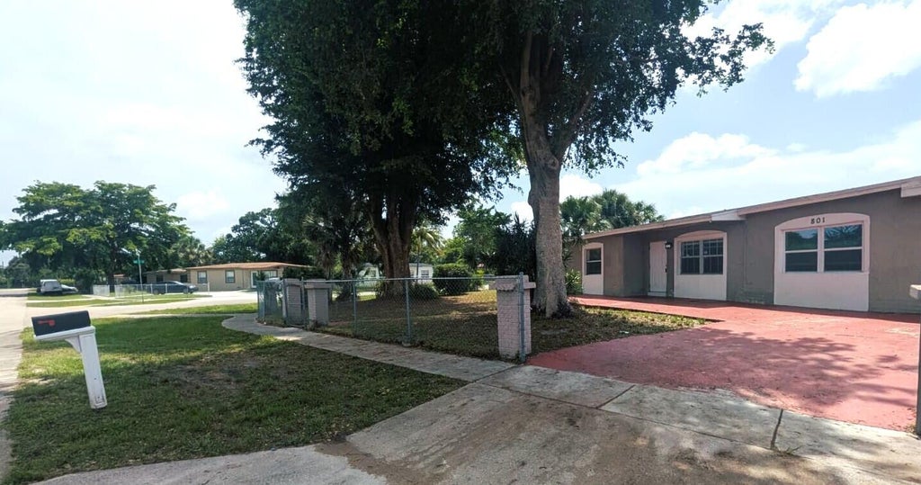 Photo of 801 NW 33rd Terrace, Lauderhill, FL 33311 (MLS # B26056534)