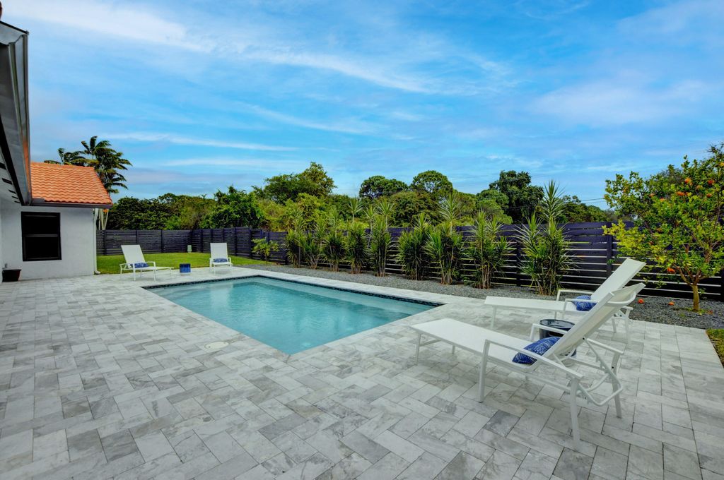 Photo of 1440 NW 12th Way, Boca Raton, FL 33486 (MLS # B26033241)