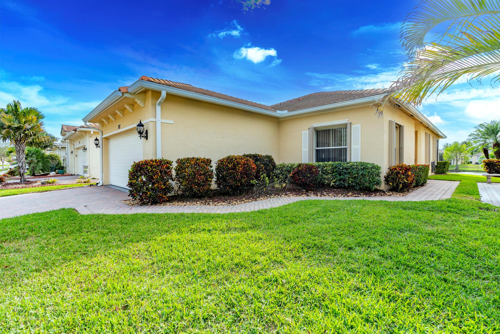 TALK ABOUT A FANTASTIC WATER VIEW! Discover comfort and convenience in this 3-bedroom, 2-bath home located in the desirable gated community of Lake Forest Pointe in St. Lucie West. This well-maintained home features a spacious floorplan for living and dining areas, an open kitchen with breakfast bar, and a cozy family room ideal for gatherings. The primary suite offers a walk-in closet and a walk-in shower. Two additional bedrooms share a full bath. Enjoy indoor laundry, a 2-car garage, and a low-maintenance lifestyle with low HOA fees that include lawn care, cable, internet, and access to a pool. Close to I-95, shopping, dining and the St Lucie Mets Stadium.