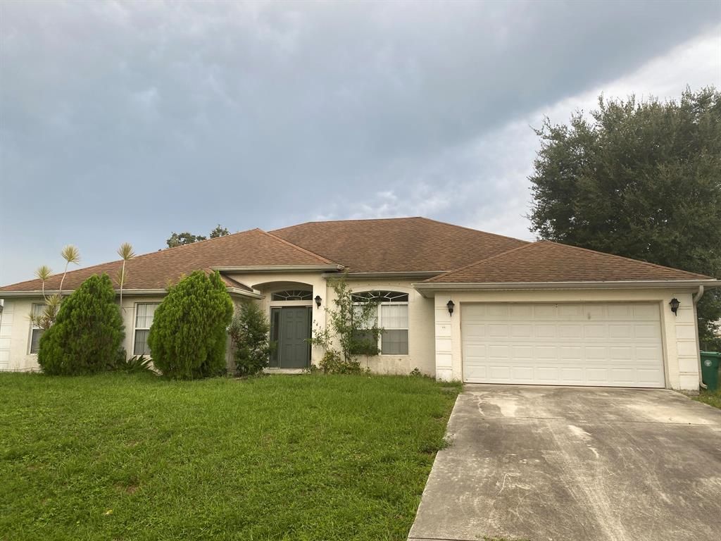 Photo of 245 SW Tulip Boulevard, Port Saint Lucie, FL 34953 (MLS # R10833170)