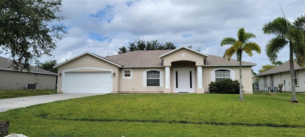 Photo of 1225 SW Asturia Avenue, Port Saint Lucie, FL 34953 (MLS # R10755930)