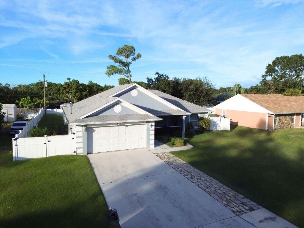 Photo of 517 NW Sherbrooke Avenue, Port Saint Lucie, FL 34983 (MLS # R11140889)