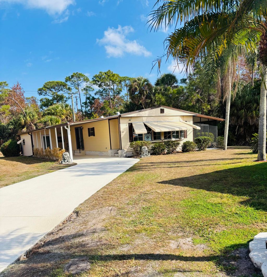 Photo of 124 W Caribbean, Port Saint Lucie, FL 34952 (MLS # R11164978)