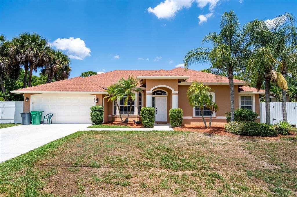 Photo of 1101 SW Ingrassina Avenue, Port Saint Lucie, FL 34953 (MLS # R10799013)