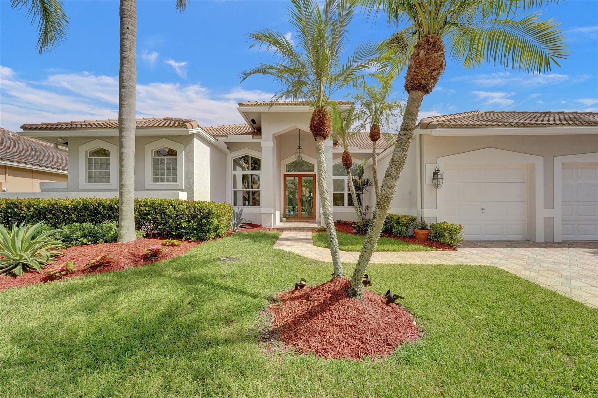 Welcome Home! This Impeccably maintained one story residence with a beautiful open pool is ready to impress! Located in the highly sought-after gated community of The Landings, this home features: 5 bedrooms+den, 3.5 baths, 3 car garage. Enjoy a spacious open layout with a desirable 3-way split bedroom plan. The updated kitchen boasts wood cabinets, quartz countertops, and plenty of natural light. The primary suite offers wood floors, two walk-in closets, and serene views of the remodeled pool. Step outside to an oversized deck and yard, perfect for entertaining family and friends. Vaulted ceilings and crown molding! Impact windows! New hot water heater. Freshly painted exterior. Paver driveway and more. This home is move-in ready! Don't miss this rare opportunity to own in The Landings!