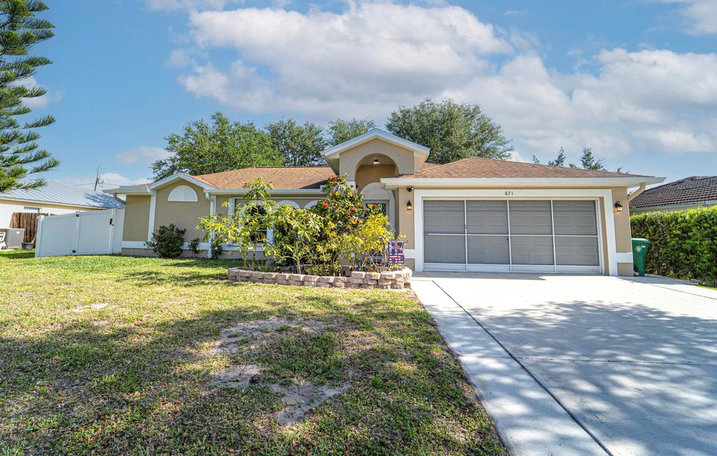 Photo of 671 SW Stillman Avenue, Port Saint Lucie, FL 34953 (MLS # R11082671)