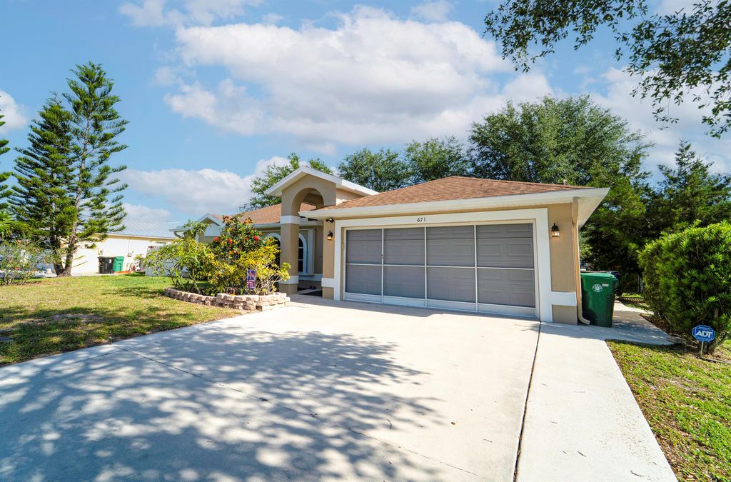 Photo of 671 SW Stillman Avenue, Port Saint Lucie, FL 34953 (MLS # R11082671)
