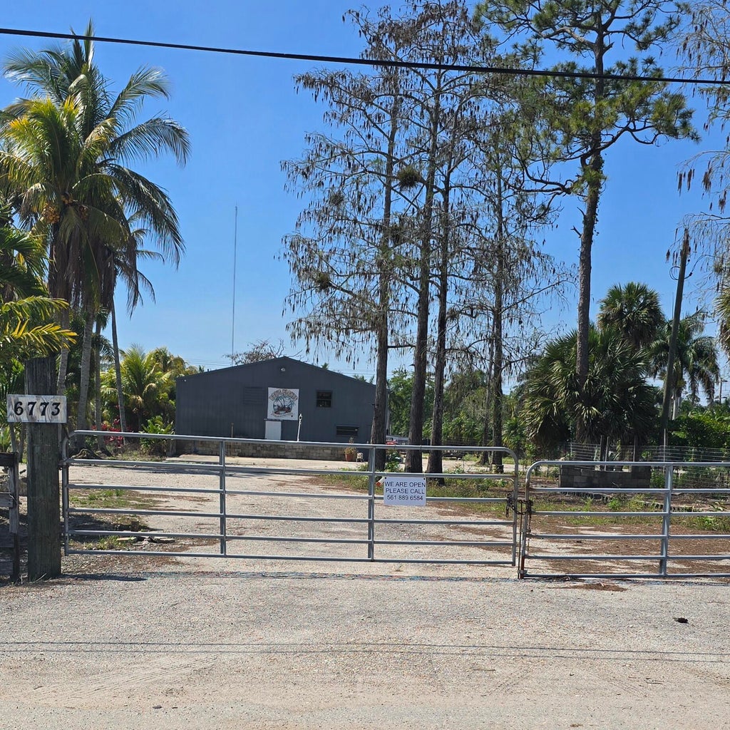 Photo of 6773 Park Lane W, Lake Worth, FL 33449 (MLS # B26008698)