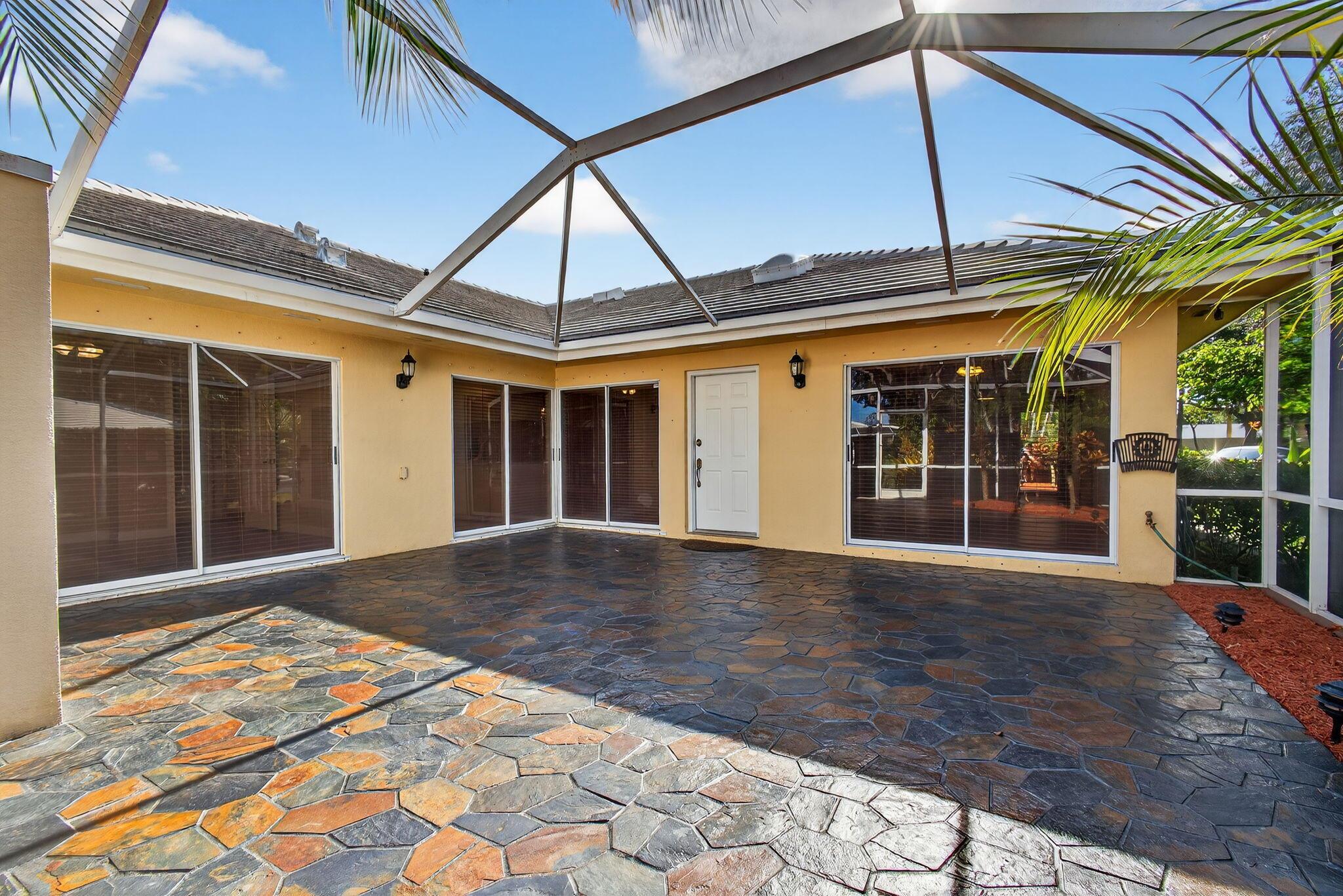 Welcome Home! This is a gorgeous and well maintained one story townhome in Sun Terrace at Lake Catherine. Large patio area well manicured for outdoor entertaining. Inside, there is a large great room, split bedrooms, wood blinds, stainless steel appliances and inside washer & dryer. There is also a community swimming pool. HOA dues cover basic landscape, irrigation, building insurance, roof replacement, painting of the building and trash. Can be rented after purchase. Close to great restaurants, shopping, and easy access to I95, Turnpike and Palm Beach International Airport
