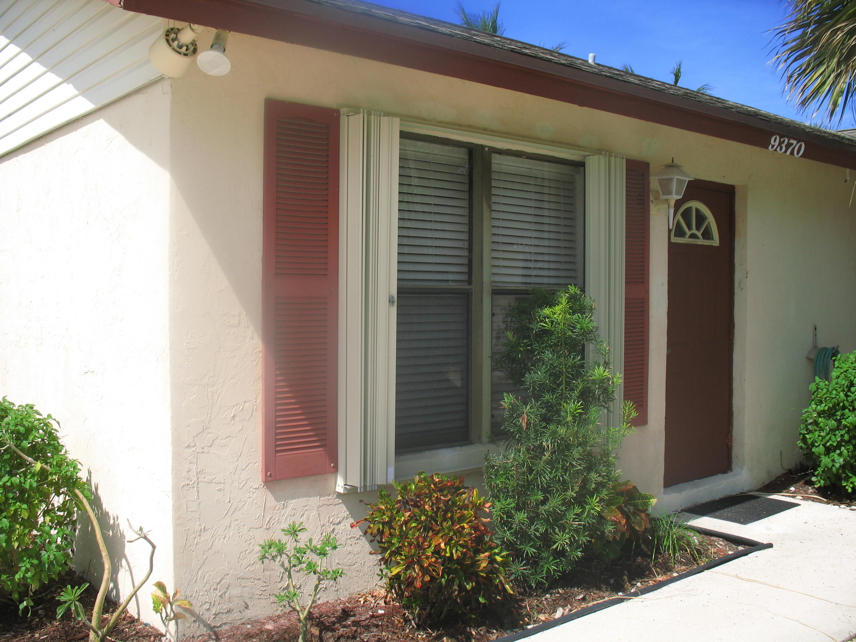Very Spacious 2/2 Corner Villa with Remodeled Eat-In Kitchen & Master Bath. Full capacity washer & dryer. Ceramic Tiles throughout. Beautiful private fenced-in backyard with blooming Plumeria trees. Freshly painted with new knockdown ceilings. Lawn Maintenance is included. Move-in Ready with NO HOA. Pet Friendly. Conveniently located just minutes from the I-95 and shopping.