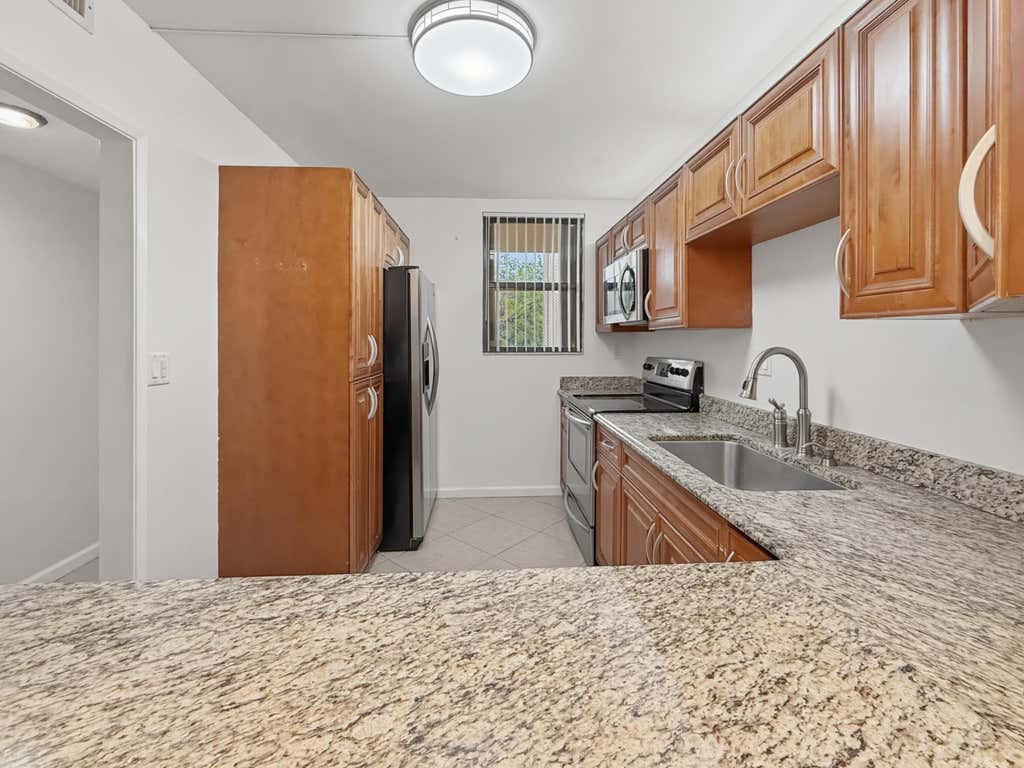 Photo of 8437 Forest Hills Drive #207, Coral Springs, FL 33065 (MLS # B26054519)