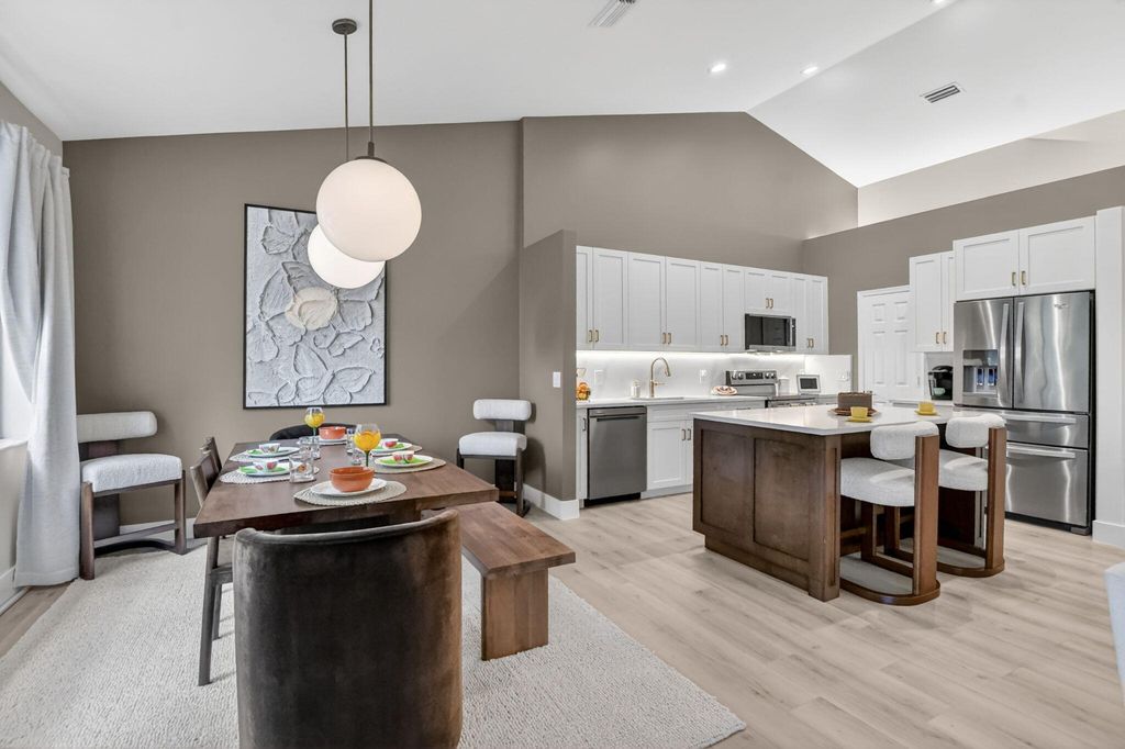Photo of 5801 Coach House Circle #E, Boca Raton, FL 33486 (MLS # B26032057)