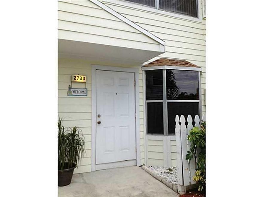 Rarely available, 2 bedroom, 2.5 bath townhouse complete with a deeded dock outside your door, accommodating up to a 35 ft boat! Updated appliances and carpet, this unit also has a nice canal front patio .  Right off of the Intracoastal, and close to the  inlet makes this home a perfect location for the avid boater or fisherman.  With golf, shopping, restaurants and beach at your fingertips, it'd a great place for a vacation or year round home!  HOA maint  $145/mo, Dock Maint. $42/mo. incl water and elect.