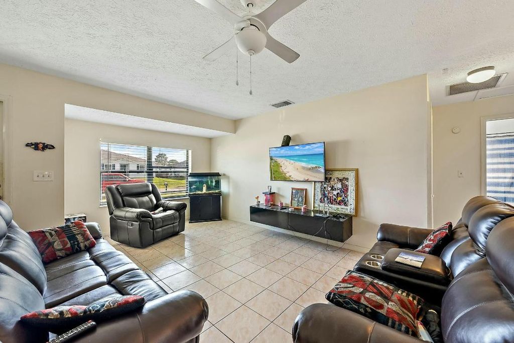 Photo of 2118 SW Trenton Lane, Port Saint Lucie, FL 34984 (MLS # R11049054)