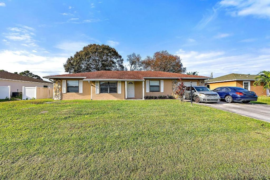 Photo of 2118 SW Trenton Lane, Port Saint Lucie, FL 34984 (MLS # R11049054)