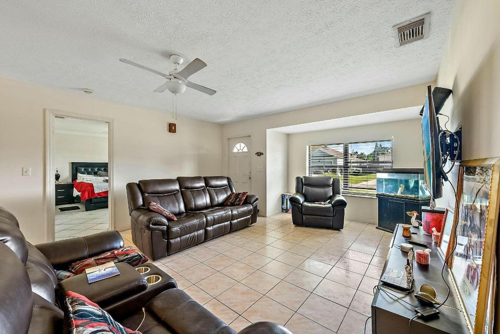 Photo of 2118 SW Trenton Lane, Port Saint Lucie, FL 34984 (MLS # R11049054)