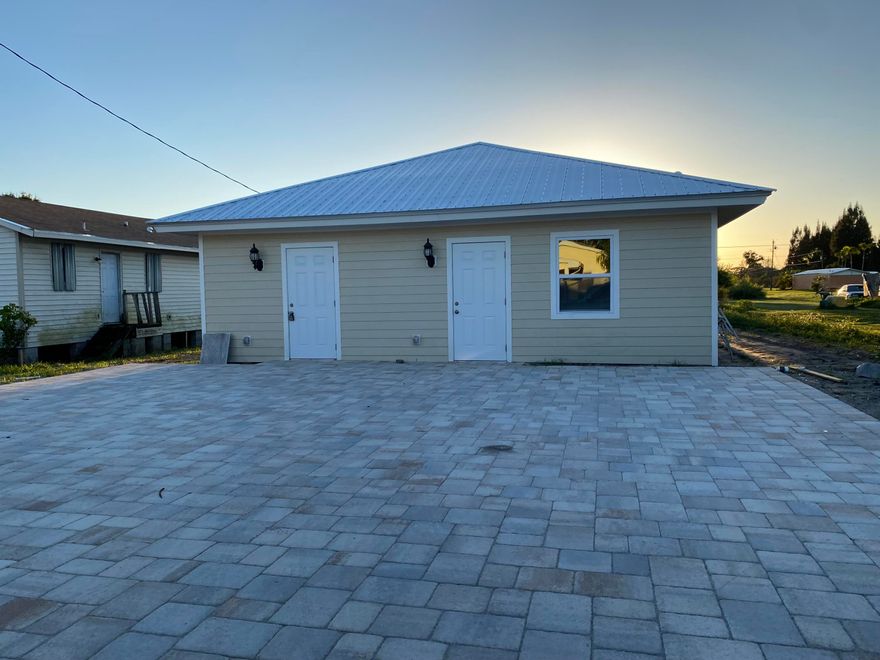 Looking for a property with NO HOA and low taxes and the potential to produce an additional income like an Air B AND B. Great starter home for a new family. This is a single family 2 bedroom property with an additional dwelling unit. The ADU has 1 bedroom with 1 bath, kitchen and appliances. Property boasts new metal roof, new kitchen and new bathrooms and 2 new AC's and is on City Water and City sewer. Enough parking for the whole family. Tile and beautiful stone finishes throughout the property. Will not last and ready for move in.