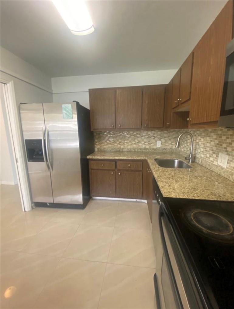 1-bedroom, 1.5-bath condo located in the desirable Palm golf course of Palm Aire Country Club. This light-filled unit features elegant porcelain tile floors throughout, an open kitchen with granite countertops, and stainless steel appliances. Enjoy serene golf course views of the lush fairways of the Palm Golf Course. The spacious layout offers a comfortable primary suite with ample closet space and a ensuite bath, plus a convenient guest powder room. Newly renovated clubhouse, two pools (one heated), saunas, BBQ areas, and a full kitchen for gatherings.
Just minutes from shopping, major highways, and the Pompano Casino.
Ready to move in and enjoy the best of country club living!