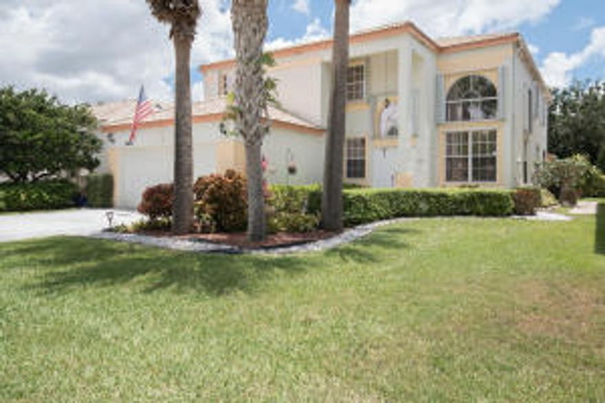 Lovely 2 story home in sought after gated community of Smith Farm offering four bedrooms plus a large den that could easily be used as a bedroom! This home has been meticulously maintained by the original owners! Features include large formal living and dining rooms with dramatic vaulted ceilings and plenty of windows, generating gorgeous natural light throughout. The kitchen has been updated with granite countertops, newer appliances and offers plenty of cabinet space plus a large pantry, lovely breakfast nook and workstation. One full bathroom plus and den downstairs too! This home also boasts unbelievable outdoor space with a custom extended, covered and screened-in patio space complete with hot tub and bar - the perfect spot for entertaining! The upstairs offers four nice sized bedrooms with laminate wood flooring and great closet space! The oversized master bedroom features a dramatic vaulted ceiling, sitting area and master bath with garden tub and huge walk-in closet!

Other features include Sunscreen Tinting on all windows, accordion shutters on all 2nd floor windows, new hot water heater and newer A/C, Bose speaker system in family room and patio and a new wireless, digital security system! The community satellite pool and new splash pad are just a short walk from the home! Built by Minto Homes, the homes in Smith Farm offer CBS construction on both the first AND second floor! This beautiful gated community offers it's residents a 24/7 manned guard gate, two community pools, a splash pad and over 8 acres of recreation including basketball, tennis, and racquetball courts, gym, playground, bike and jogging path and an on site property manager. Located near a variety of shopping and dining options and excellent schools including Coral Reef Elementary, Woodlands Middle and Park Vista Community High School! Smith Farm is truly a neighborhood you'll love to call home!