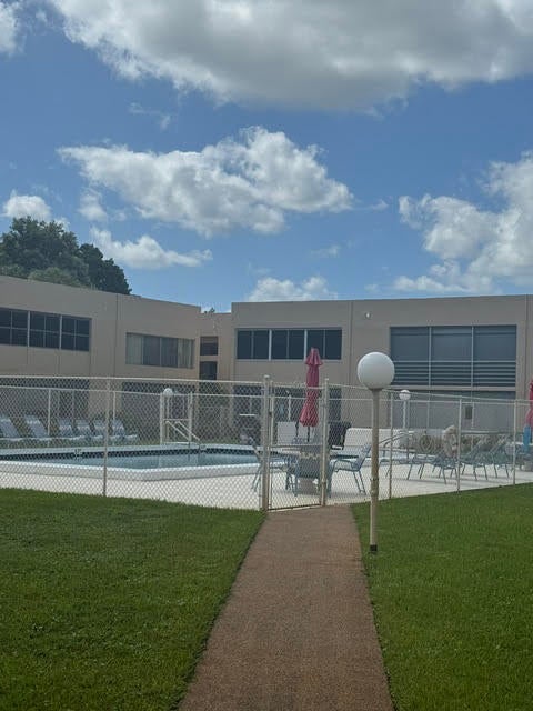 Photo of 3212 Strawflower Way #104, Lake Worth, FL 33467 (MLS # B26094579)