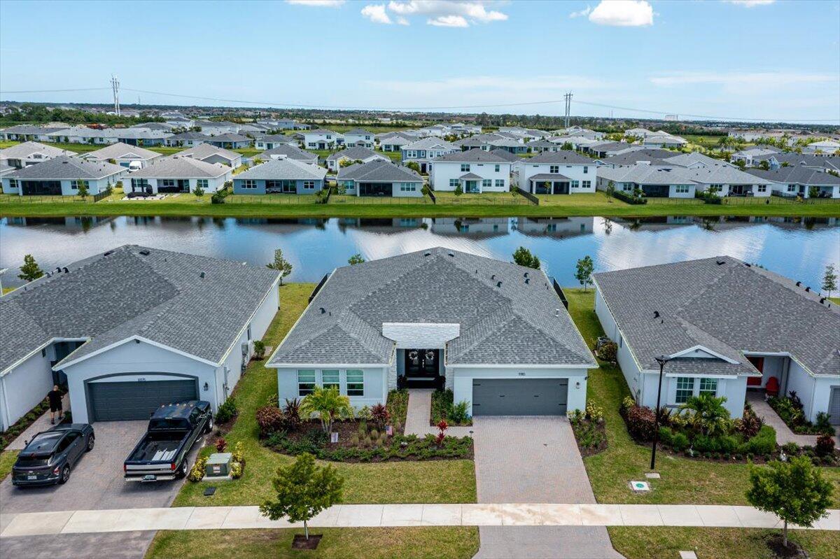 Welcome to this stunning 4 bedroom, 3 bath, 2-car garage lakefront home in the heart of Tradition! Built in 2023, this move-in ready residence offers a modern open-concept design with tile flooring in main living areas, plush carpet in bedrooms, and stainless steel appliances. Enjoy breathtaking southeast lake views and gorgeous sunsets from your backyard. The gated community provides resort-style amenities including a pool, lawn care, irrigation, cable, internet, HBO, and alarm monitoring--all included in the HOA. Additional features include an EV charger in the garage and a prime location close to shopping, dining, and easy access to I-95. Why wait to build when you can move right in?