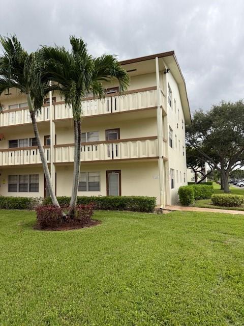 Spacious 2nd-floor outside corner unit with wood-look floors in the living area, carpet in bedrooms, full bathroom with shower, half bathroom, and a screened patio with pull-downs. Currently tenant-occupied, making it an excellent income property. Century Village offers resort-style living for 55+, including internet and WiFi, fitness center, pools, clubhouse with live shows, movies, bingo, card rooms, classes, trips, tennis, and community buses. Conveniently located near shopping and restaurants.