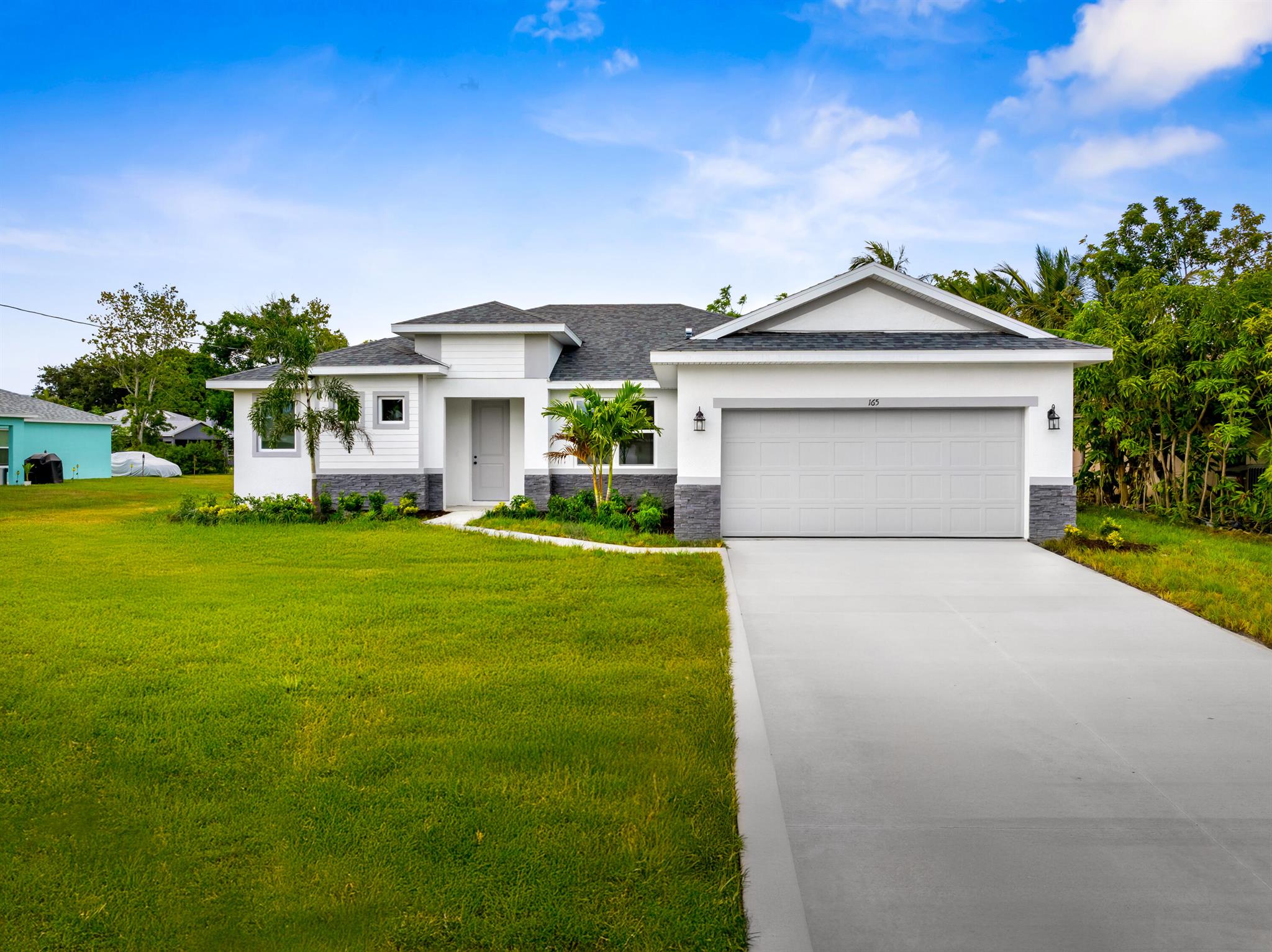 This new construction 4 bedroom Coastal model is in a great area and loaded with upgrades. These upgrades include impact windows, 8 foot doors, stacked stone on the exterior, plank tile throughout, quartz countertops, tile backsplash, oversized shower tile to the ceilings, frameless glass in spa like master shower, huge walk in closets, island in the kitchen and UNDERGROUND POWER and the list goes on.
