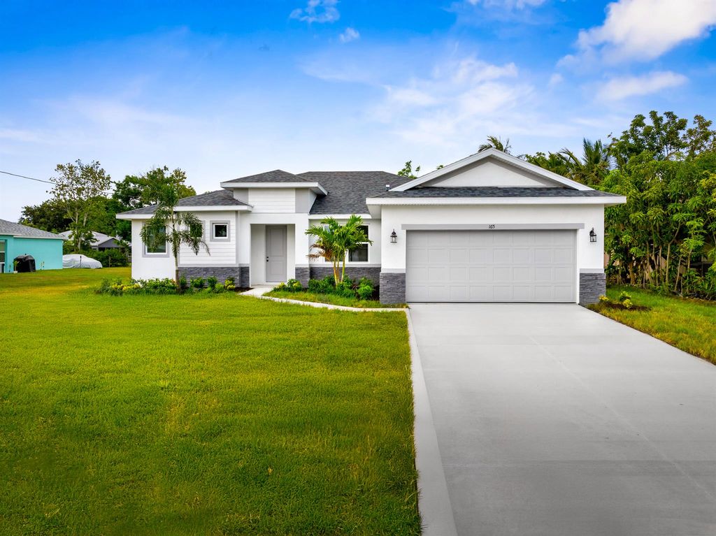 Photo of 2433 SW Hinchman Street, Port Saint Lucie, FL 34984 (MLS # R11103852)