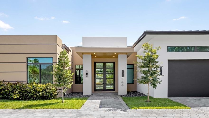 Welcome to 144 Coconut Road, a stunning brand-new modern masterpiece just minutes from downtown Delray Beach and the ocean. This luxury residence boasts an elegant master suite with a generous walk-in closet and spa-inspired bath, three spacious guest bedrooms plus an office or gym. The gourmet kitchen features top-of-the-line Thermador appliances, ideal for culinary enthusiasts. Enjoy seamless indoor-outdoor living with 10' sliders opening to a summer kitchen and sparkling pool, ideal for entertaining. Meticulously crafted with sleek finishes and designer touches, this home offers the best value in new construction, luxury, comfort, and sophistication all in one exceptional residence.