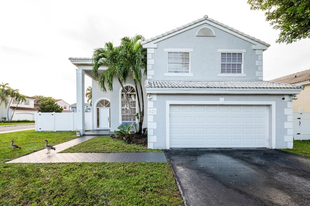 Photo of 621 Lakeshore Terrace, Davie, FL 33325 (MLS # B26004449)