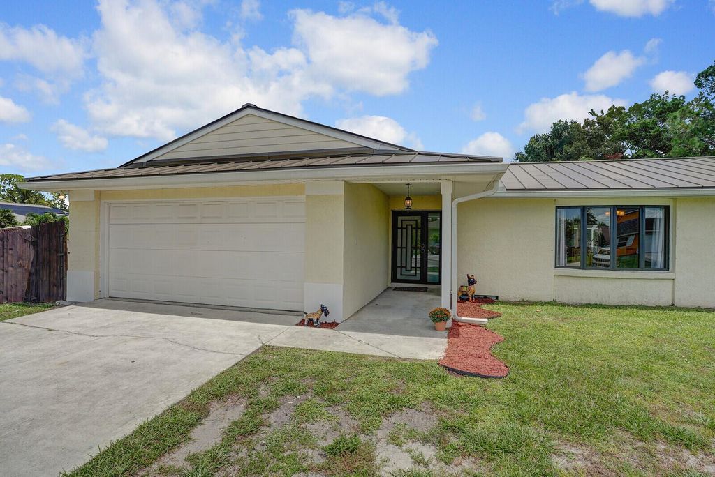 Photo of 1601 SW Buffum Lane, Port Saint Lucie, FL 34984 (MLS # R11117325)