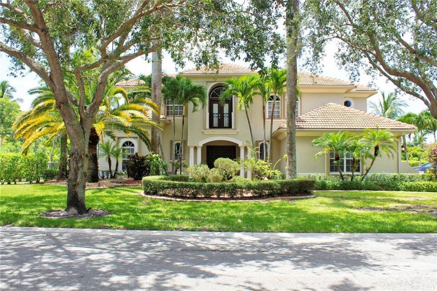 Come see this tastefully updated 3,945 sq foot 5 bedroom, 4 and a half bathroom courtyard home with an oversized 3 car garage on half an acre in Fox Ridge Estates. 1 year HOME WARRANTY and seller is contributing $5,000 towards the buyers closing costs.   Separate guest house with a bedroom and full bathroom right off the sparkling blue pool and spa that was recently refinished. Travertine floors downstairs with wood upstairs and in the 1st floor master bedroom. New roof in 2020, new accordion shutters, 2 new AC units and recently painted. Smart home features to control lights, pool, spa, alarm, Sonos sound system, garage doors, door locks, sprinklers, AC's and cameras remotely. Short bike ride or walk to all the local schools - Park Trails, Heron Heights, Westglades and Stoneman Douglas.
