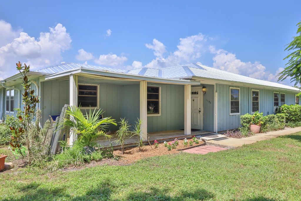 Photo of 1194 NE Coy Senda, Jensen Beach, FL 34957 (MLS # R10912065)