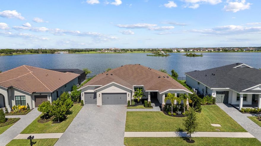Paradise on the lake! Every inch of this home has been customized and meticulously cared for. 4-bed plus office, 3.5-bath. Over $350k in upgrades; 16'x36' heated saltwater pool with marble deck, custom aluminum front doors, motorized screened lanai, whole home generator, fully fenced private yard with lake access, tall clusia hedge and professional landscaping. Custom designed interior; bookmatch slabs on walls, multiple custom wood features and closets, fireplace, motorized blinds, epoxy garage flooring and much more. Spend your evenings fishing in the back yard or relaxing on the pool deck with breathtaking sunsets. Walking distance to the new elementary school. A-rated K-12 all nearby. Resort style living with miles of walking trails, 2 club houses, boat ramp, fishing piers, pools, pickleball, tennis, basketball, skate park, dog parks, working farm with organic produce included for residents and more.