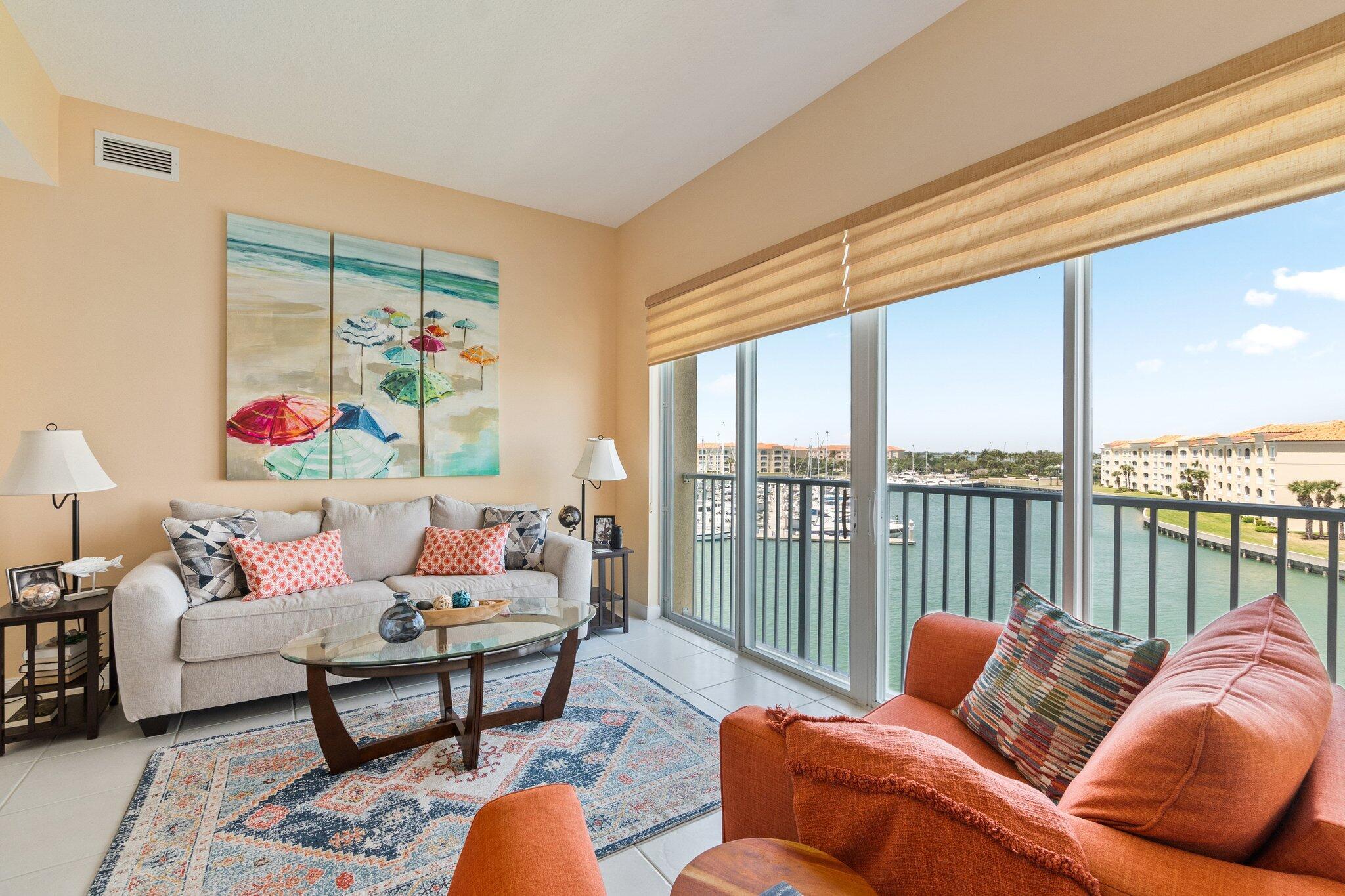 Live the high life in this elegant top-floor residence featuring soaring ceilings, impact glass windows, and a bright, open layout filled with natural light. Enjoy panoramic views of the marina from the spacious Florida room - perfect for morning coffee or evening sunsets. The oversized kitchen offers ample space for cooking and entertaining, while refined finishes throughout add a touch of sophistication. Located in the sought-after Harbour Isle West community, where resort-style amenities include a grand clubhouse, pool, fitness center, tennis courts, and more. A rare opportunity to enjoy luxury living on Hutchinson Island! Located near the Indian River Lagoon and Atlantic Ocean, enjoy fishing, boating, and the marina for yachts up to 100 feet!