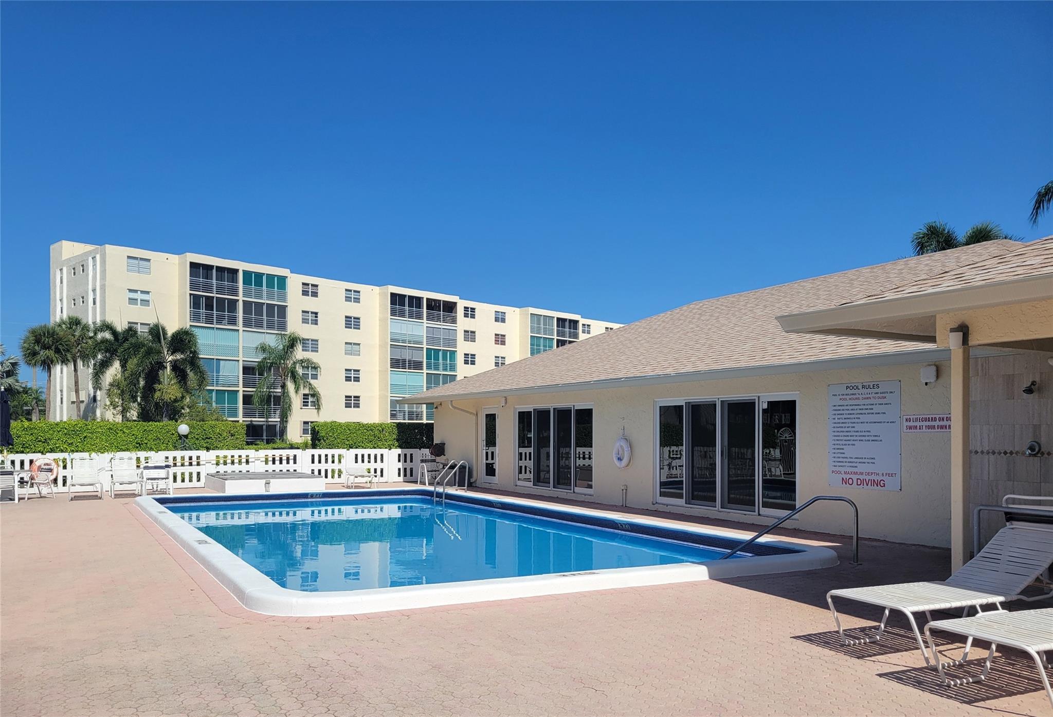 Wake up to stunning lake views in this oversized 1,100+ sq ft 2BR/2BA corner unit at Meadowbrook Lakes, a sought-after 55+ Dania Beach community. Corner layout offers rare windows in both bedrooms for abundant natural light. New hurricane-impact windows (Mar 2024) & roll-down balcony shutters for added protection. Relax on the screened balcony overlooking serene water, steps from the pool, clubhouse, elevator, laundry & storage. Enjoy a well-maintained neighborhood with resort-style amenities including pools, shuffleboard & social rooms. Prime location minutes to Hollywood Beach, Dania Pointe, dining, shopping & FLL Airport.. Building passed 40-year recertification in 2021. Move-in ready with immediate rental potential—ideal for investors or a low-maintenance coastal lifestyle!