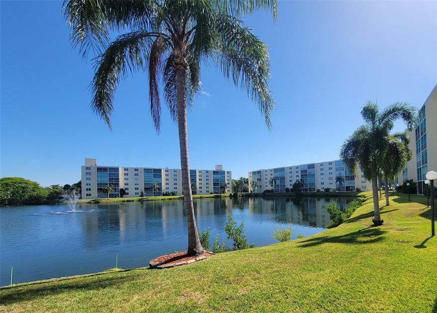 Wake up to stunning lake views in this oversized 1,100+ sq ft 2BR/2BA corner unit at Meadowbrook Lakes, a sought-after 55+ Dania Beach community. Corner layout offers rare windows in both bedrooms for abundant natural light. New hurricane-impact windows (Mar 2024) & roll-down balcony shutters for added protection. Relax on the screened balcony overlooking serene water, steps from the pool, clubhouse, elevator, laundry & storage. Enjoy a well-maintained neighborhood with resort-style amenities including pools, shuffleboard & social rooms. Prime location minutes to Hollywood Beach, Dania Pointe, dining, shopping & FLL Airport.. Building passed 40-year recertification in 2021. Move-in ready with immediate rental potential—ideal for investors or a low-maintenance coastal lifestyle!