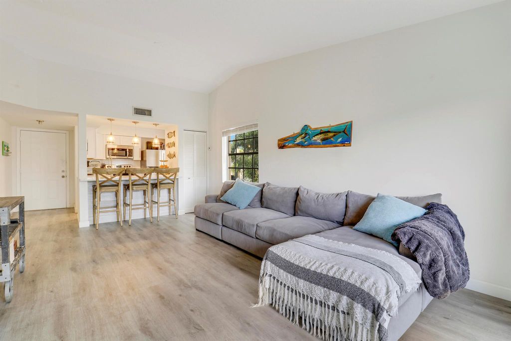 Photo of 1035 Lake Shore Drive #204, Lake Park, FL 33403 (MLS # R11000335)