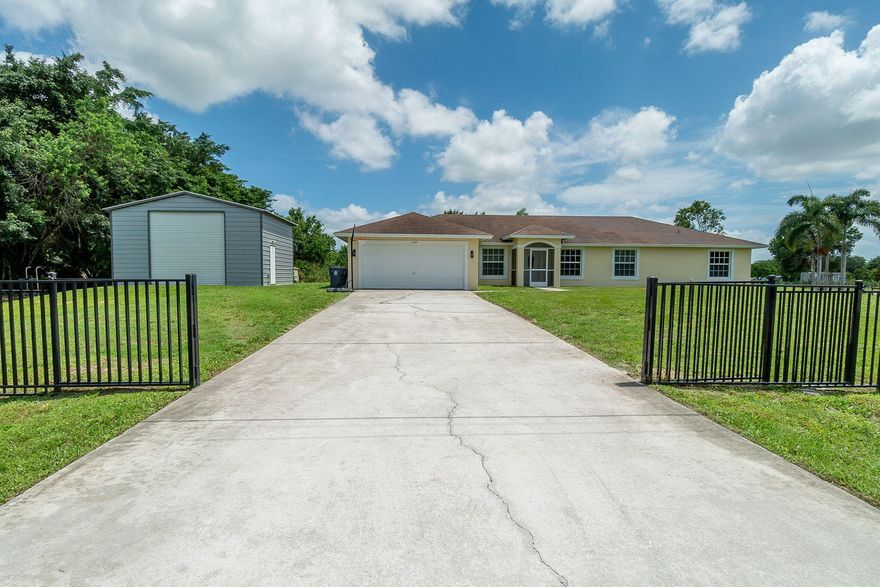 Come to the Acreage where you'll get so much more for your money! Spread out into this 5 bedroom, 2.5 bath, 2 car garage CBS home WITH AN INGROUND POOL equipped with a waterfall, 20 x 24 air conditioned shop, 50 amp RV hookup, completely screened in patio with a built in grill station, and a 10 x 10 shed. The 20 x 24 shop (completed in 2023) has a 12' roll up door with 14' ceilings and a 100 amp capacity electrical subpanel. 2 bedroom and half bath addition was just completed in April 2024. BRAND NEW ROOF completed May 2026 with a fully transferable warranty. Phenomenal place to raise kids or to enjoy a taste of the country life while being close to all of the modern conveniences.