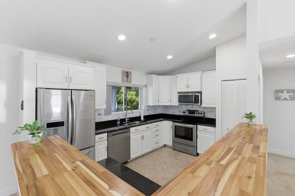 Photo of 131 NE Naranja Avenue, Port Saint Lucie, FL 34983 (MLS # R11158859)