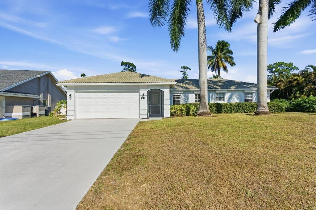 Photo of 131 NE Naranja Avenue, Port Saint Lucie, FL 34983 (MLS # R11158859)